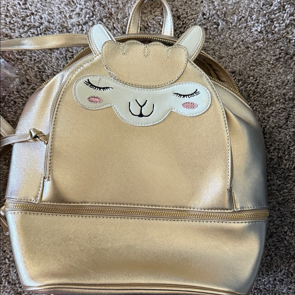 UNDER ONE SKY gold backpack 318
